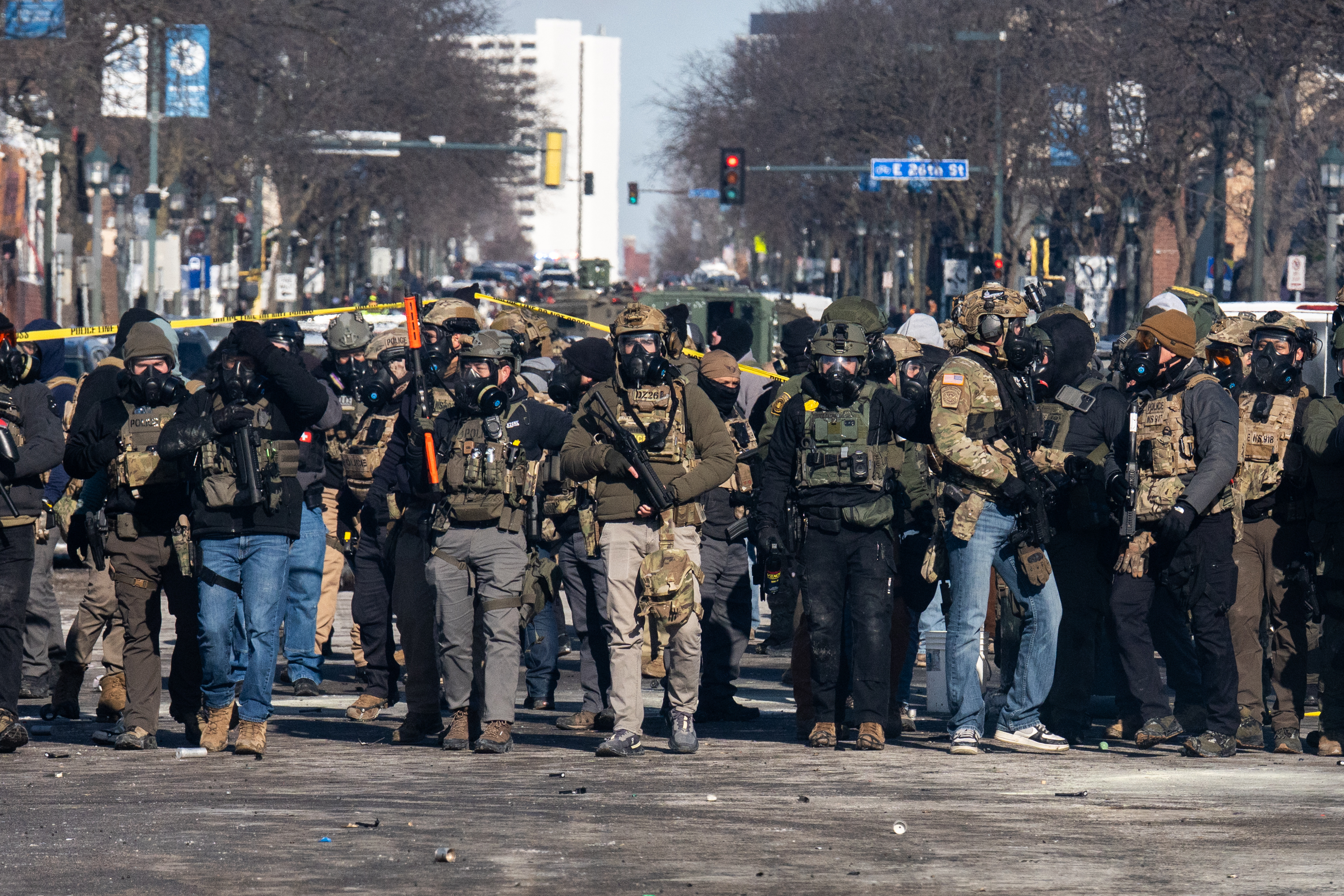 Line of federal agents in tactical gear on a Minneapolis street, January 24, 2026